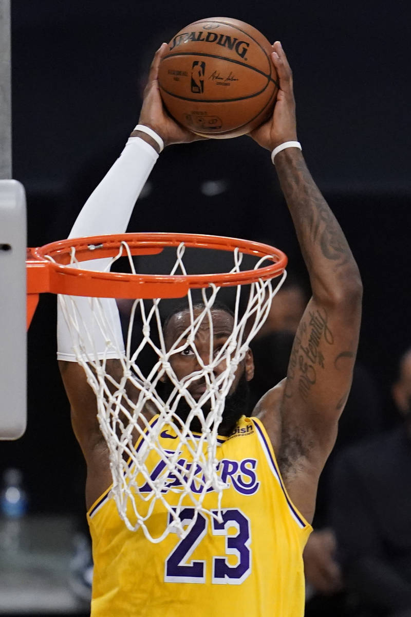 Los Angeles Lakers forward LeBron James dunks during the second quarter of the team's NBA baske ...