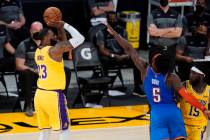 Los Angeles Lakers forward LeBron James (23) makes a 3-pointer against the Oklahoma City Thunde ...