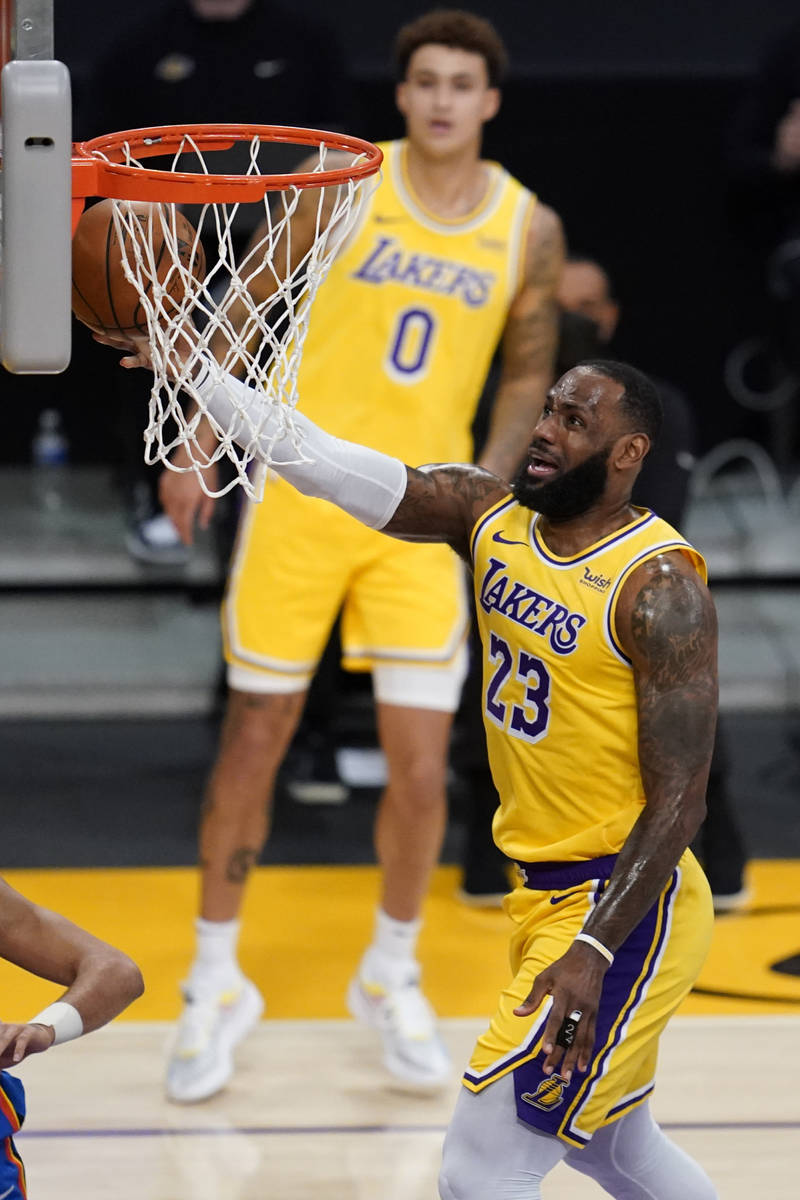 Los Angeles Lakers forward LeBron James shoots during the first quarter of the team's NBA baske ...