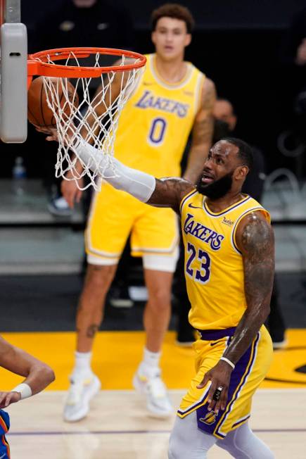 Los Angeles Lakers forward LeBron James shoots during the first quarter of the team's NBA baske ...