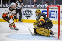 Golden Knights goaltender Marc-Andre Fleury (29) eyes a shot on goal by Anaheim Ducks center Tr ...