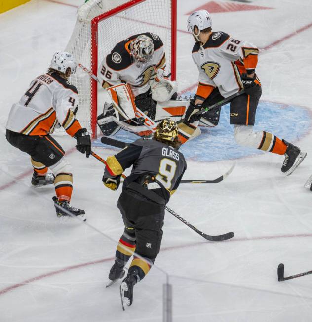 Golden Knights center Cody Glass (9) has a shot on goal stopped by Anaheim Ducks goaltender Joh ...