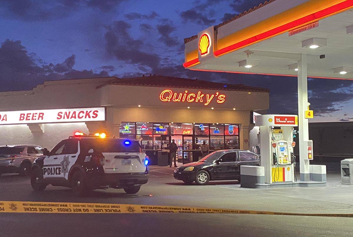 Police cordoned off the parking lot of the Quicky’s Shell station at Jones Boulevard and Crai ...