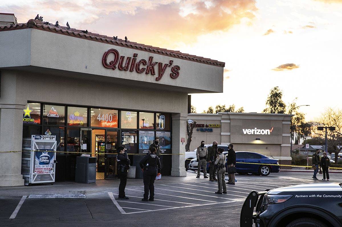 Police cordoned off the parking lot of the Quicky’s Shell station at Jones Boulevard and ...
