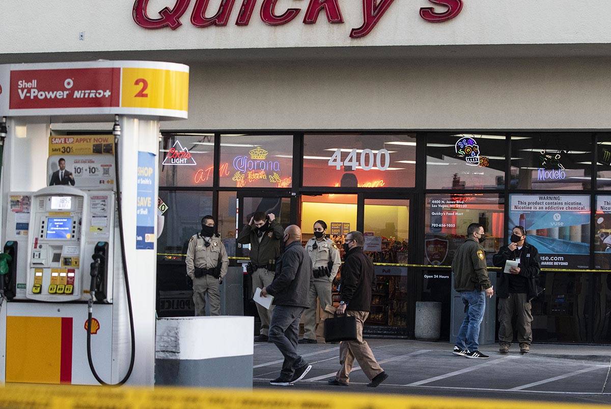 Police cordoned off the parking lot of the Quicky’s Shell station at Jones Boulevard and ...