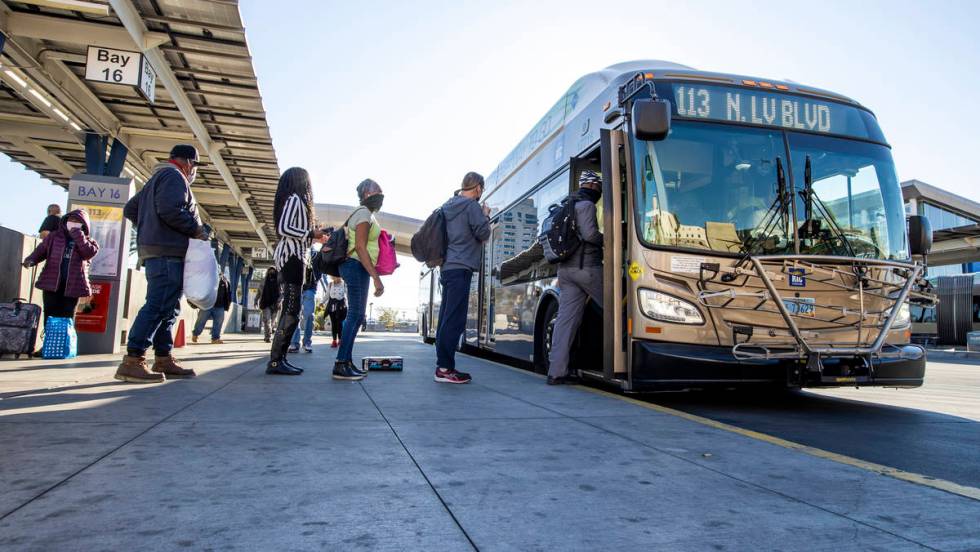 Passengers board a bus at the Bonneville Transit Center operated by the Regional Transportation ...
