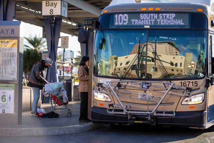 A nearby building is reflected in the front window of a bus at the Bonneville Transit Center op ...