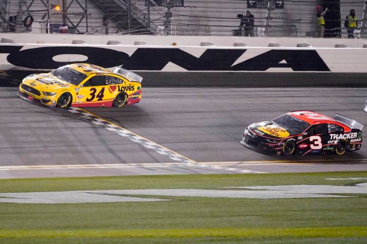 Michael McDowell crosses the finish line ahead of Austin Dillon to win the NASCAR Daytona 500 a ...