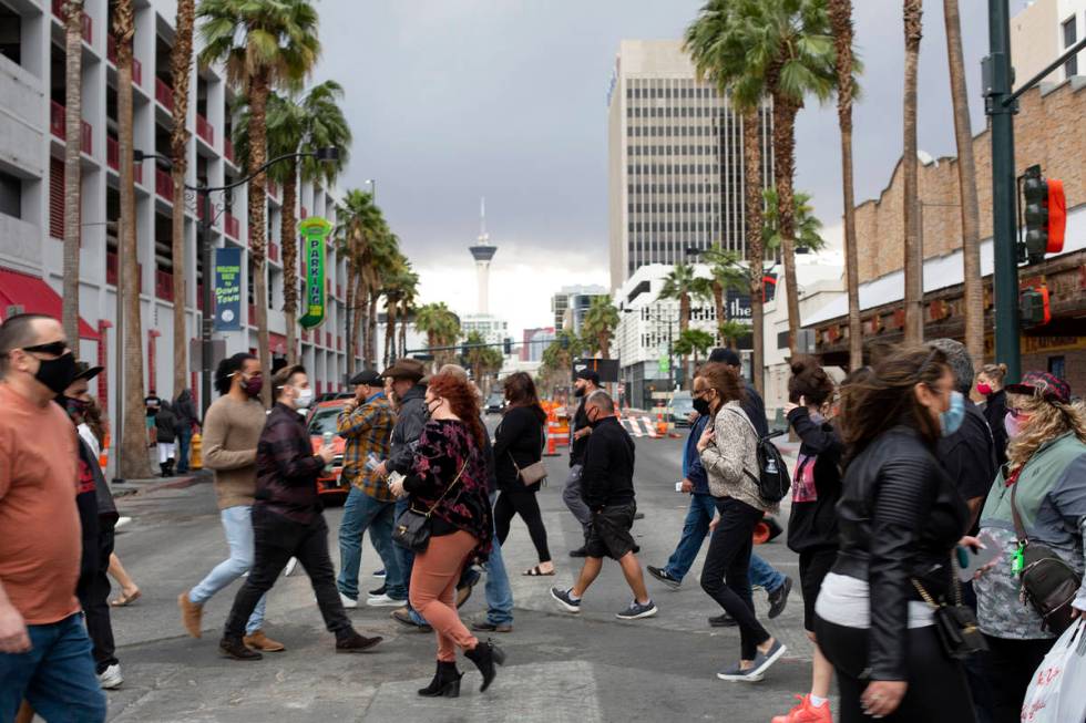 Visitors to Fremont Street Experience cross 4th Street after Clark County issued a severe thund ...