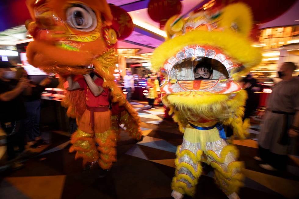 Michael Buenavista, right, with The Lohan School of Shaolin, performs the Chinese Lion dance in ...