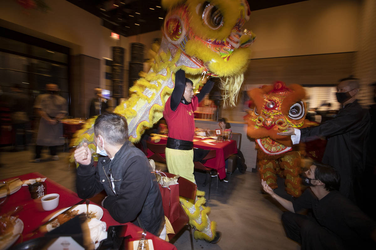 Jr. Seraphin, center, with The Lohan School of Shaolin, performs the Chinese Lion dance in cele ...
