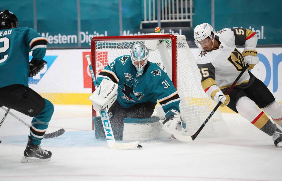 San Jose Sharks goaltender Martin Jones (31) makes a save against Vegas Golden Knights right wi ...