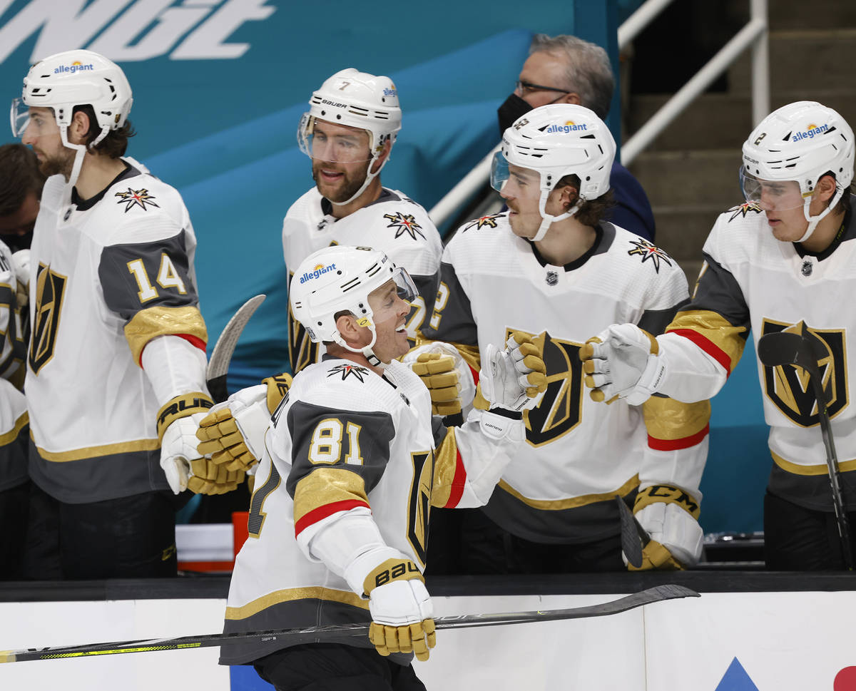 Vegas Golden Knights center Jonathan Marchessault (81) celebrates with the bench after scoring ...