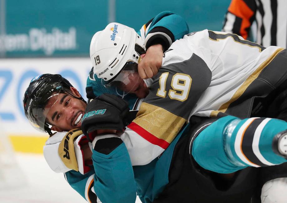 San Jose Sharks left wing Evander Kane (9), bottom, fights with Vegas Golden Knights right wing ...