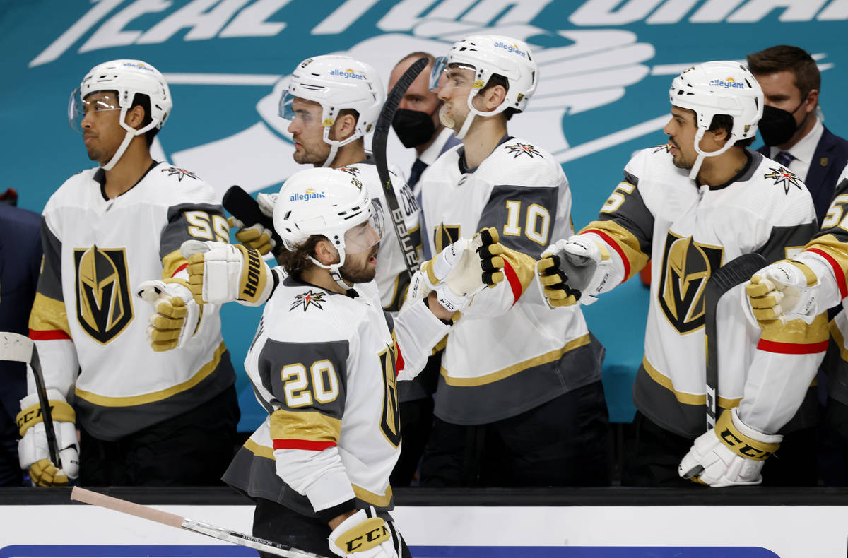 Vegas Golden Knights center Chandler Stephenson (20) celebrates with the bench after scoring a ...