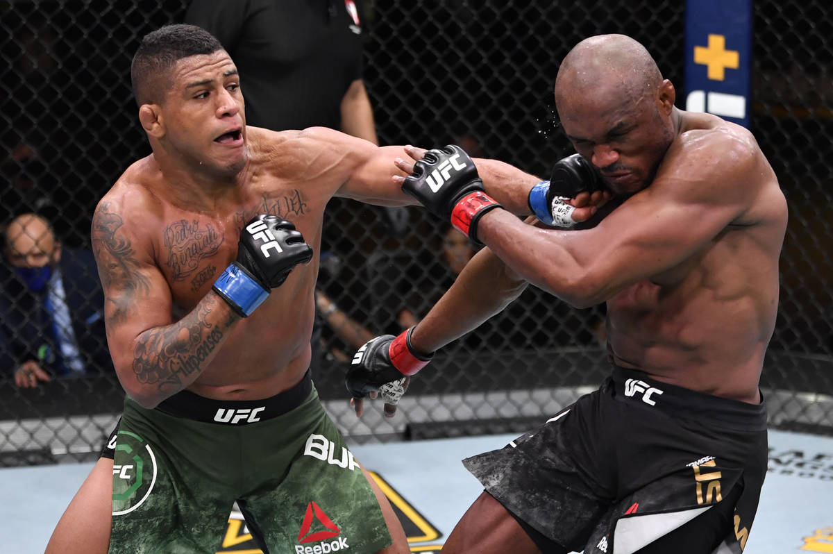 (L-R) Gilbert Burns of Brazil punches Kamaru Usman of Nigeria in their UFC welterweight champio ...