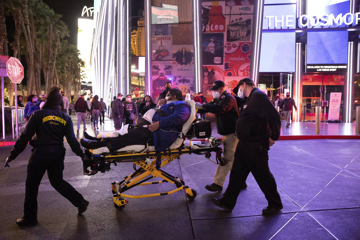 A person is taken on a stretcher after emergency crews responded to a fire at The Cosmopolitan ...