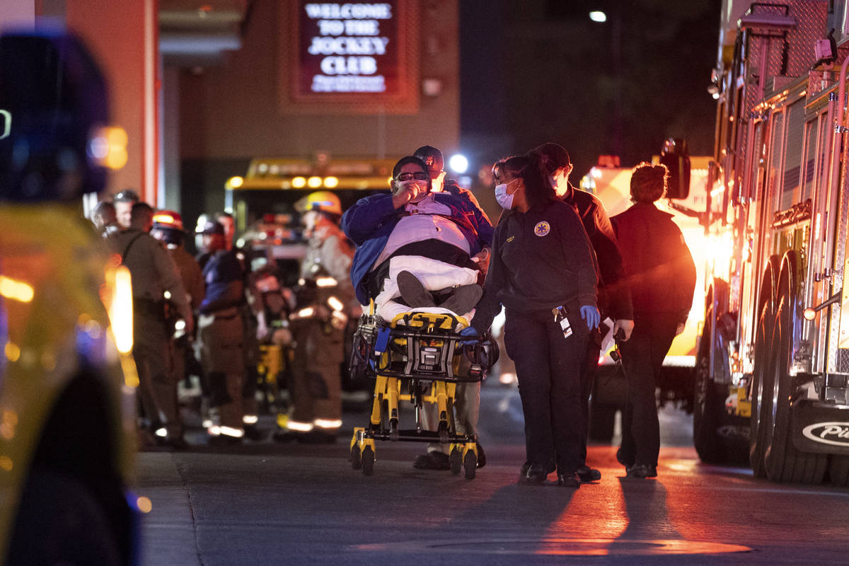 A person is taken on a stretcher after emergency crews responded to a fire at The Cosmopolitan ...