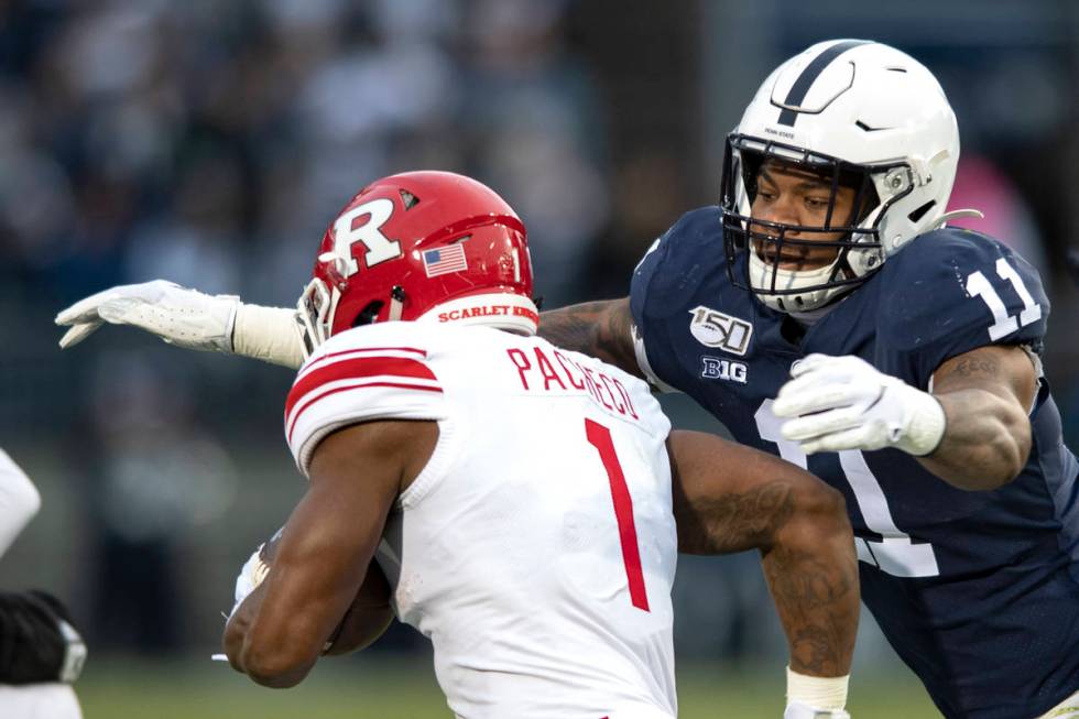Penn State linebacker Micah Parsons (11) tackles Rutgers running back Isaih Pacheco during an N ...