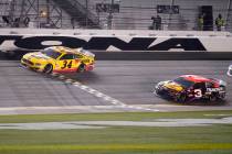 Michael McDowell crosses the finish line ahead of Austin Dillon to win the NASCAR Daytona 500 a ...