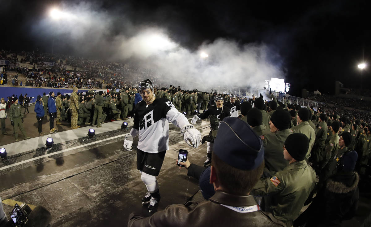 Los Angeles Kings defenseman Kurtis MacDermid is congratulated by cadets while heading back to ...