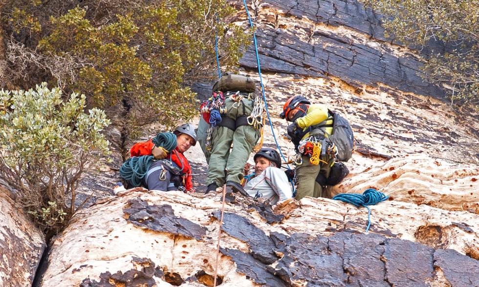 Metropolitan Police Department search and rescue lowers a climber to an extraction point after ...