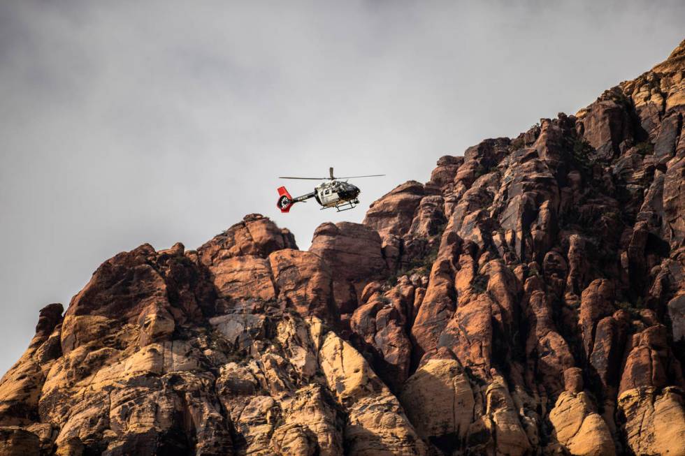 A Metropolitan Police Department search and rescue helicopter prepares to extract a climber tha ...