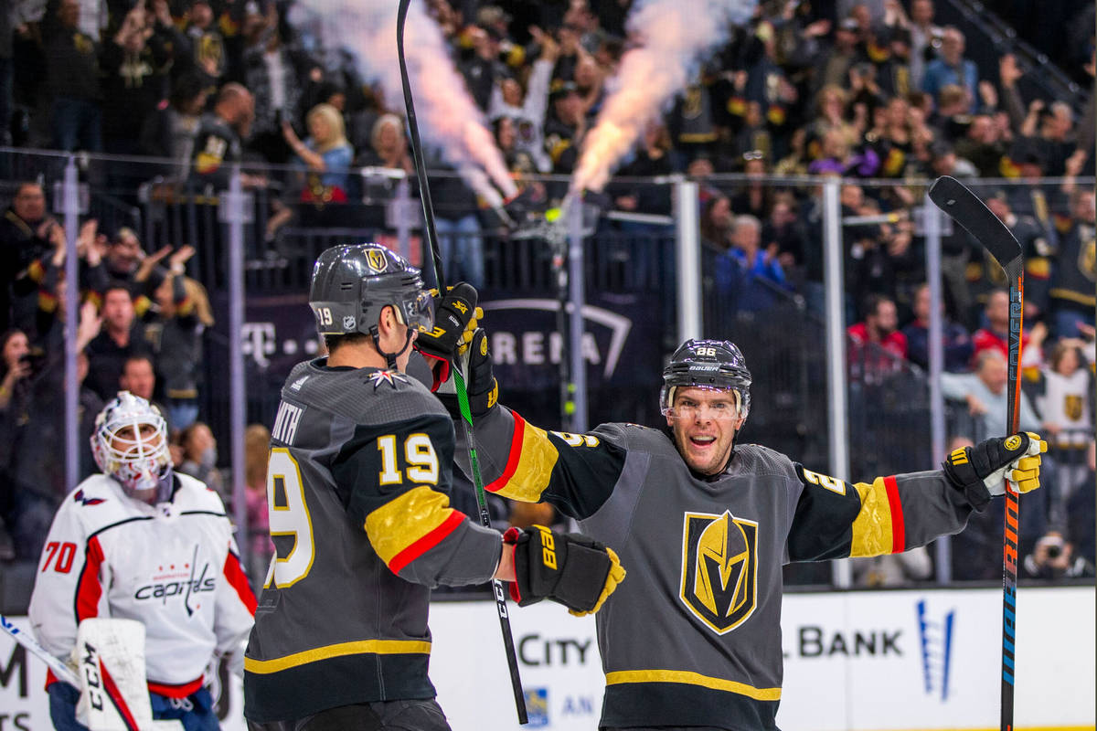 In this Feb. 17, 2020, file photo, Vegas Golden Knights right wing Reilly Smith (19, left) come ...