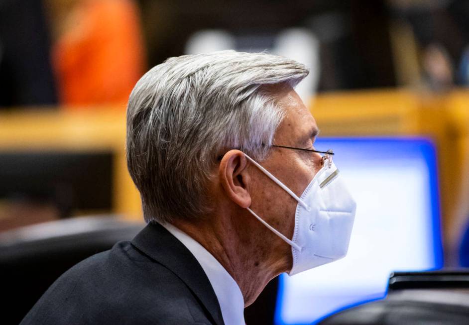 David Riggleman, communications director for the City of Las Vegas, wears a KN95 mask during a ...