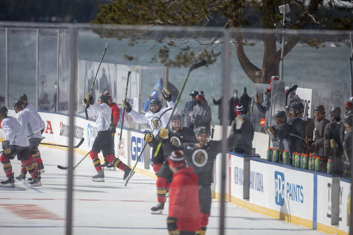 Vegas Golden Knights celebrate a big play during practice on an outdoor rink in preparation for ...
