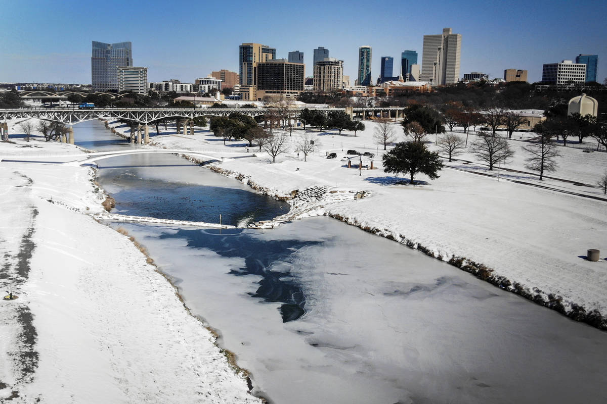 The Trinity River is mostly frozen after a snow storm Monday, Sept. 15, 2021, in Fort Worth, Te ...