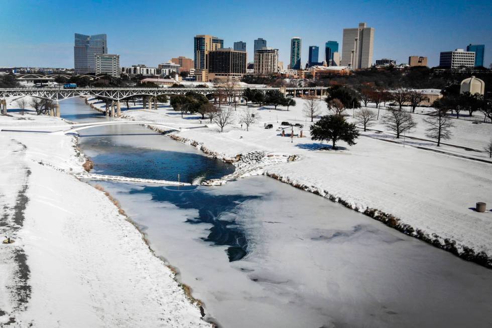 The Trinity River is mostly frozen after a snow storm Monday, Sept. 15, 2021, in Fort Worth, Te ...