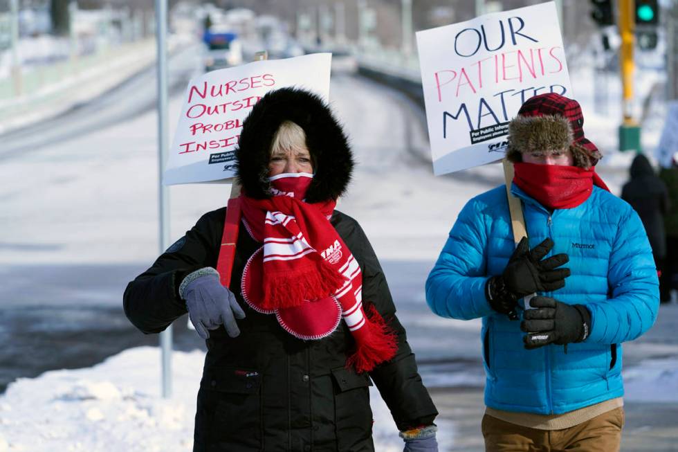 Nurses, including Mary Turner, left, picket Friday, Feb. 12, 2021 in Faribault, Minn.,as part o ...