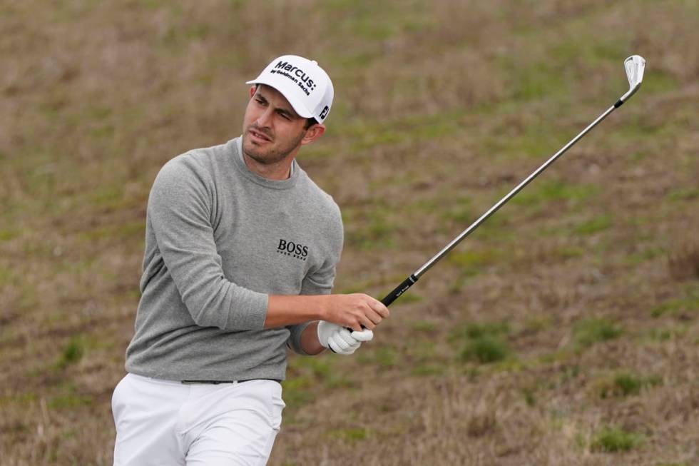 Patrick Cantlay follows his approach shot up to the sixth green of the Pebble Beach Golf Links ...