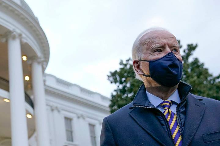 President Joe Biden walks on the South Lawn of the White House to board Marine One after speaki ...