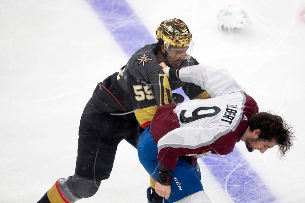 Golden Knights right wing Keegan Kolesar (55) fights with Colorado Avalanche defenseman Dennis ...