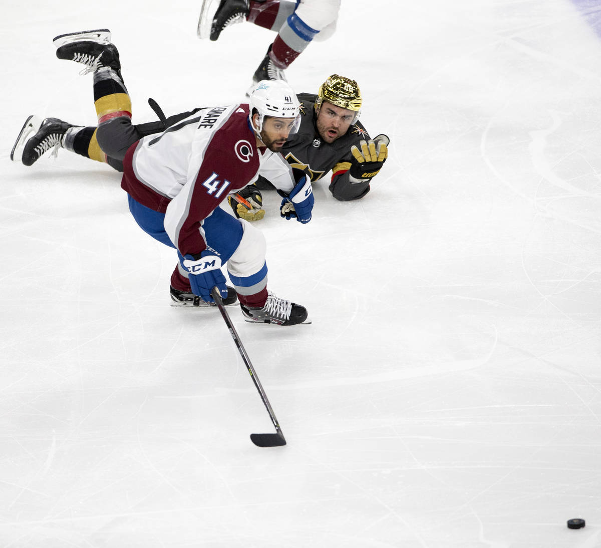 Golden Knights left wing William Carrier (28) and Colorado Avalanche center Pierre-Edouard Bell ...