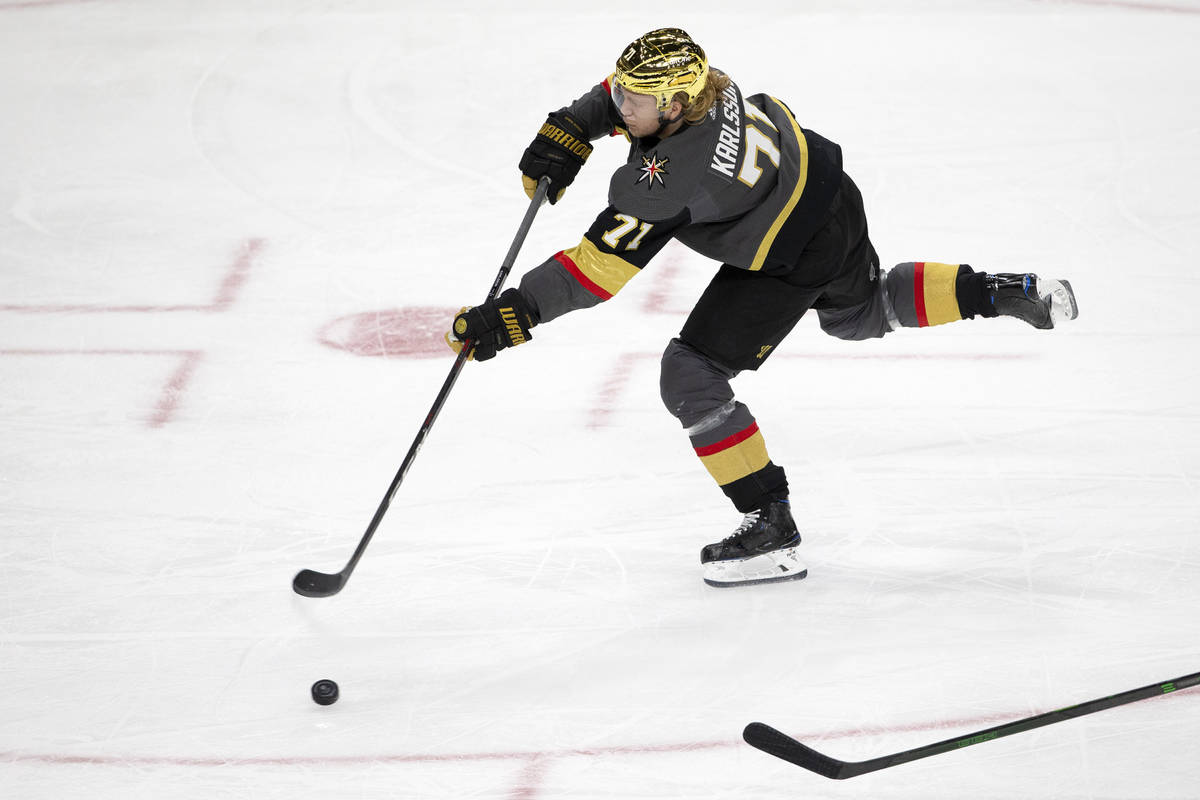 Golden Knights center William Karlsson (71) assists the second goal for his team during the thi ...