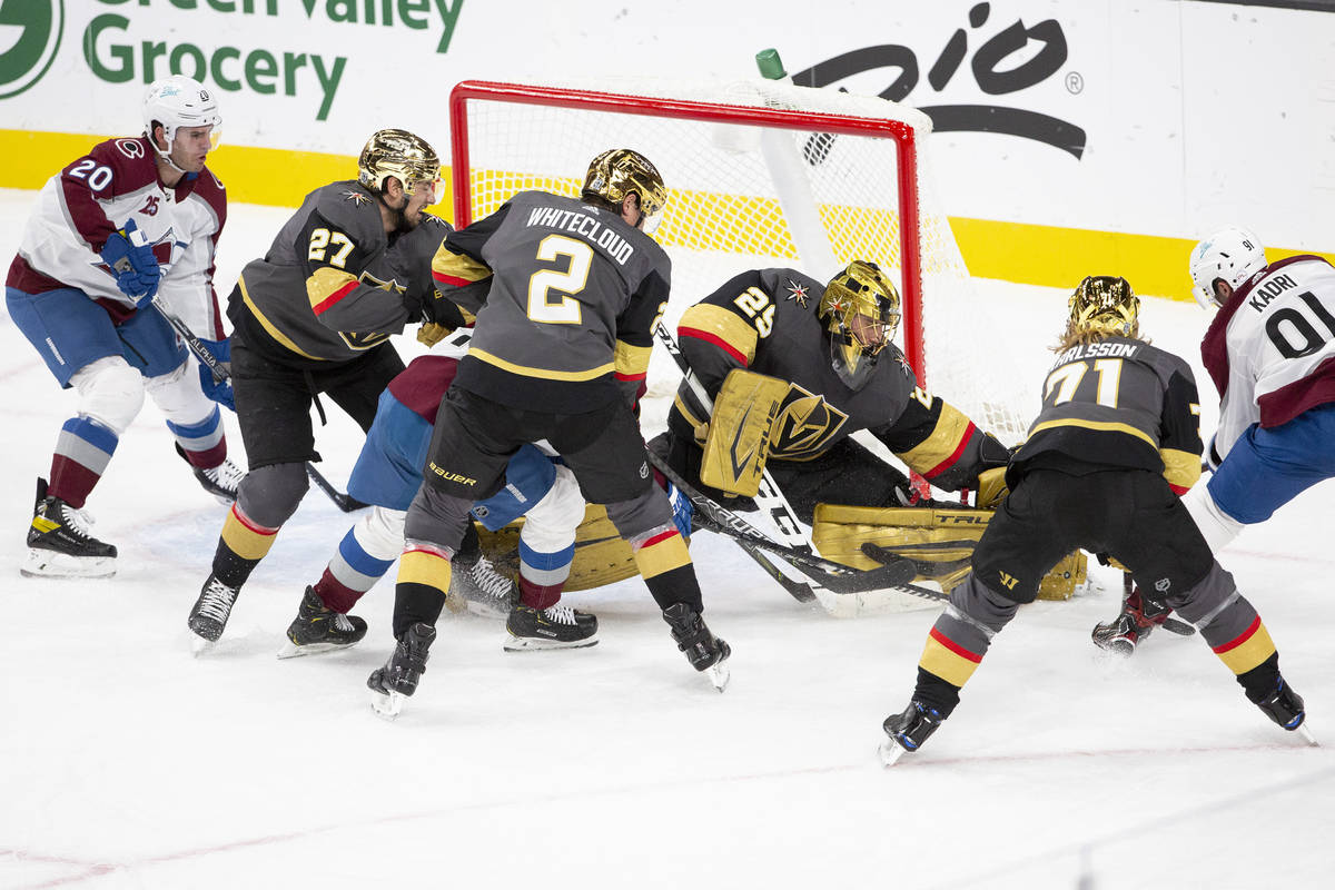 Golden Knights goaltender Marc-Andre Fleury (29) lets in a goal by Colorado Avalanche center Na ...
