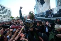 An attendee crowd surfs during the Punk Rock Bowling music festival in downtown Las Vegas on Sa ...