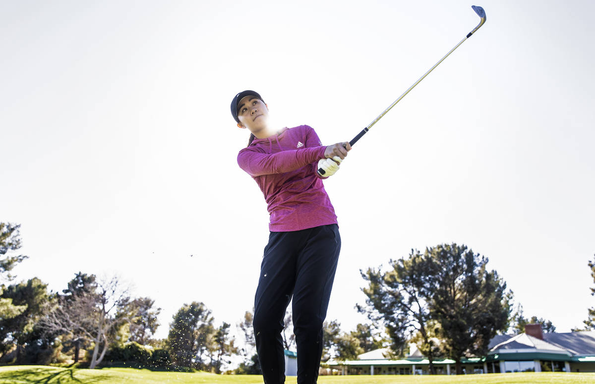 Las Vegas resident Danielle Kang, ranked in the top 5 on the LPGA tour, plays the 18th hole at ...