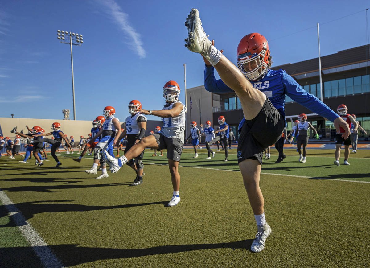 Bishop Gorman's D.J. Herman (25) leads stretching during practice on Friday, Feb. 19, 2021, at ...