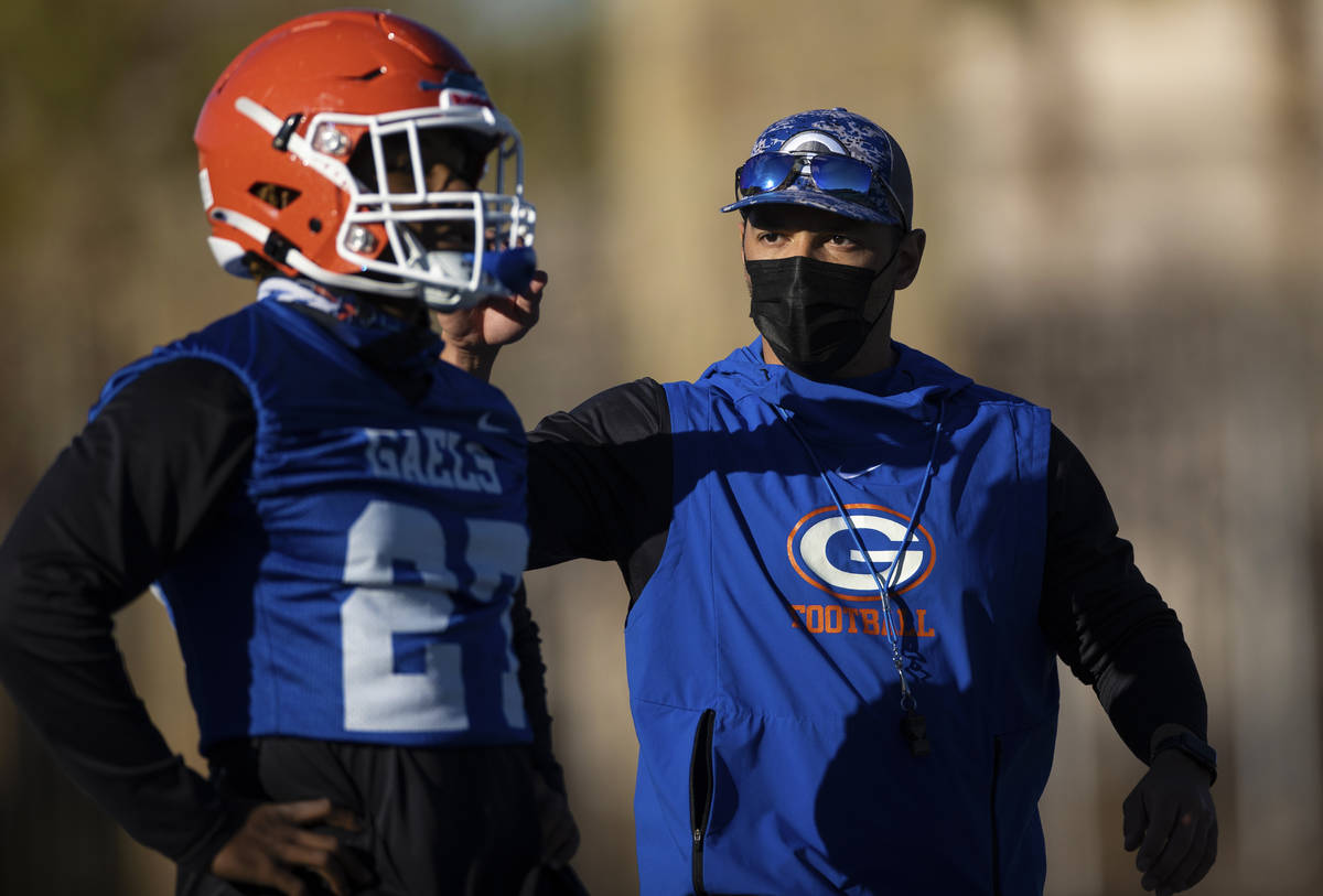 Bishop Gorman head football coach Brent Browner, right, leads practice on Friday, Feb. 19, 2021 ...
