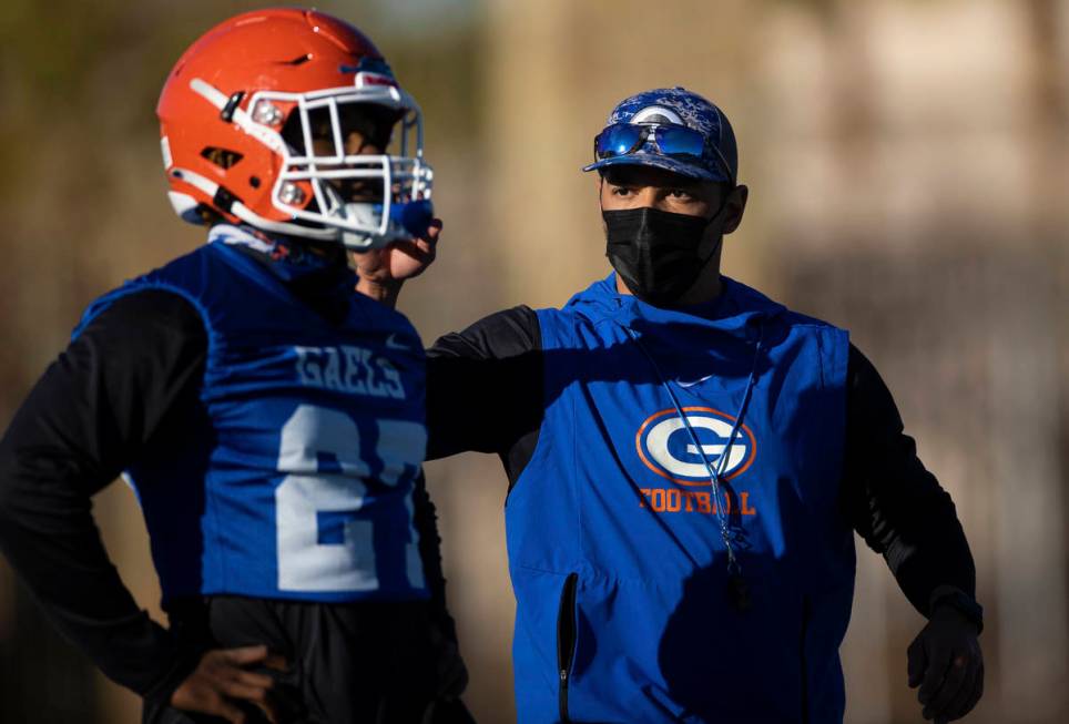 Bishop Gorman head football coach Brent Browner, right, leads practice on Friday, Feb. 19, 2021 ...