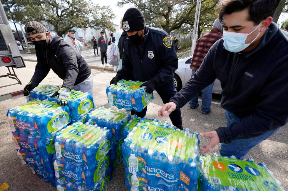 Donated water is distributed to residents, Thursday, Feb. 18, 2021, in Houston. Houston and sev ...