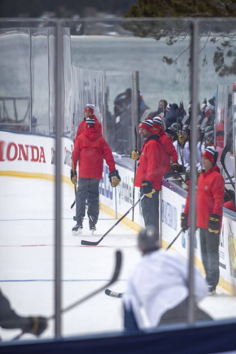 Vegas Golden Knights head coach Pete DeBoer, center, looks on as the team practices on an outdo ...