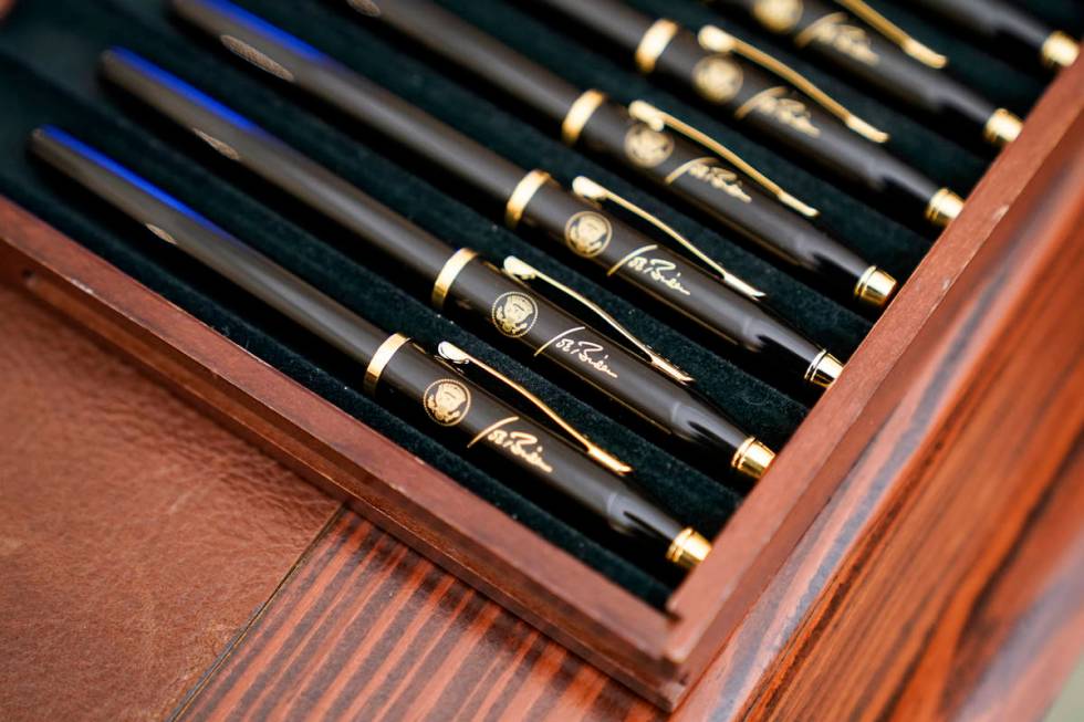 FILE - In this Jan. 21, 2021, file photo pens featuring President Joe Biden's signature and pre ...