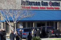 Jefferson Parish Sheriff's Office deputies investigate a shooting at the Jefferson Gun Outlet i ...