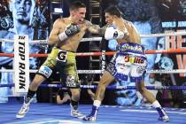 Oscar Valdez, left, and Miguel Berchelt exchange punches during their fight for the WBC super f ...