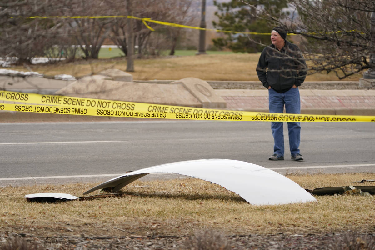 A piece of debris from a commercial airplane is surrounded by police tape on a strip along Midw ...